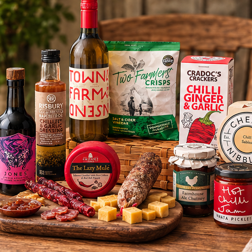 A styled charcuterie and cheese spread on a wooden table, featuring an assortment of gourmet foods including cheeses and crackers
