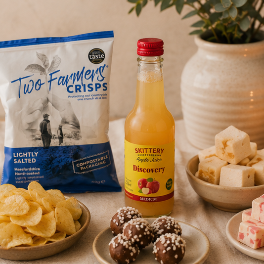 Small artisan gift hamper with apple juice, chocolate and sweet treats